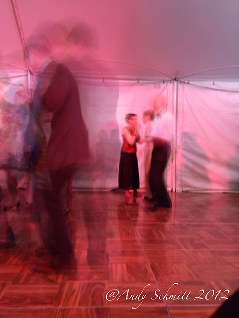 Group of fashionably dressed people slow dancing