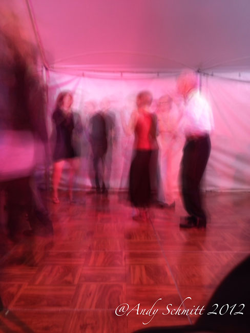 Group of fashionably dressed people slow dancing