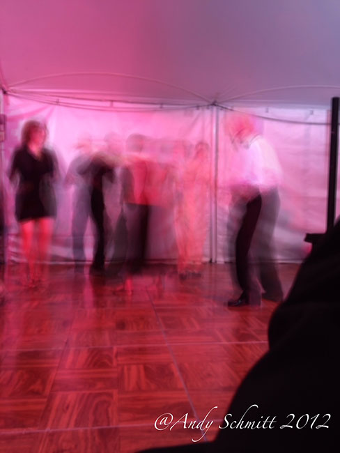 Group of fashionably dressed people slow dancing 